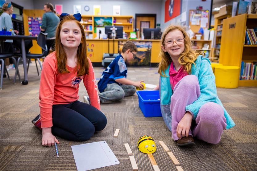 Students use Bee-Bots in the Learning Commons